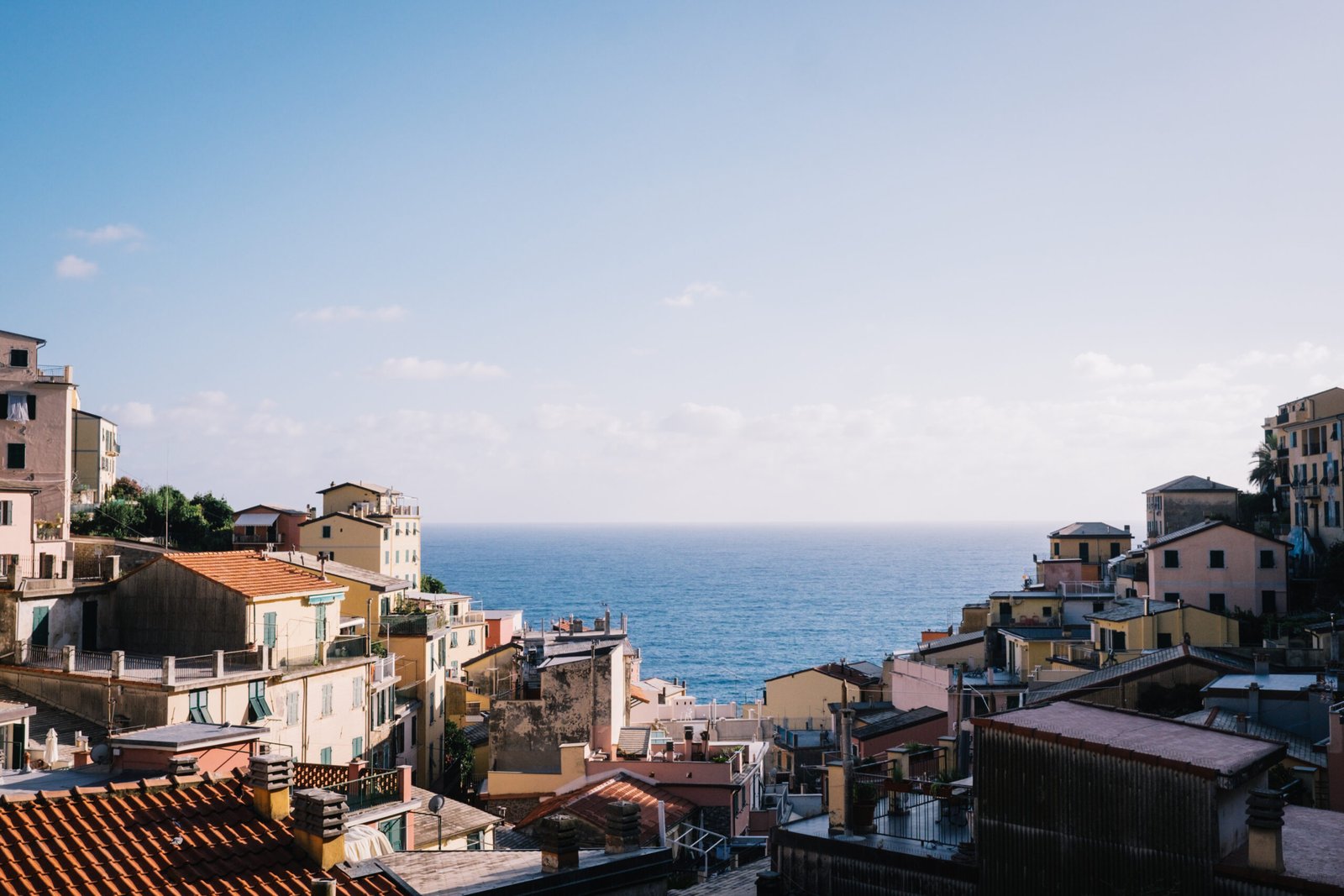 high-angle-view-townscape-by-sea-against-sky